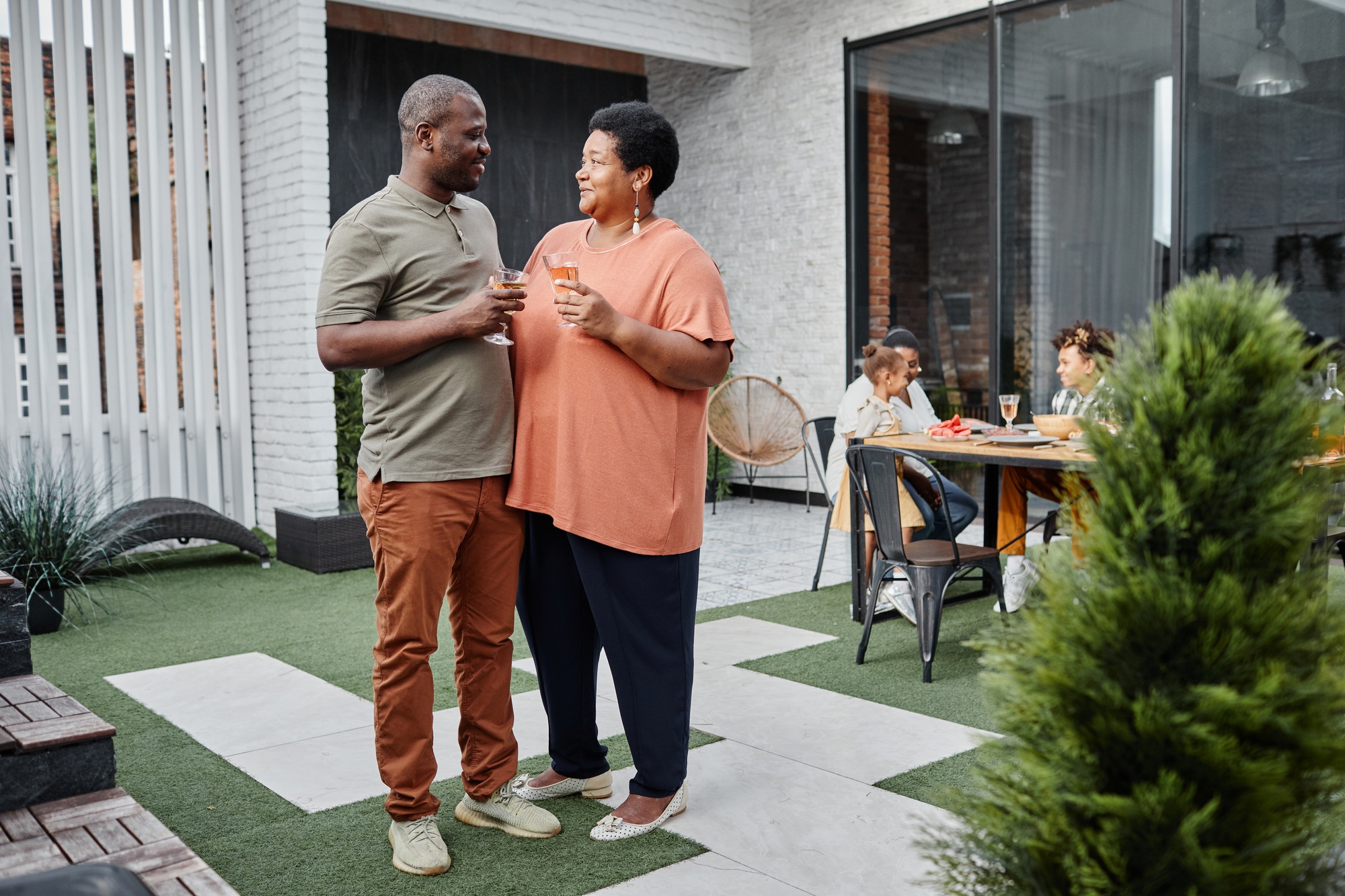 Senior African American Couple by House